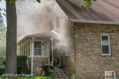 Wilmette house fire 7-30-16 at 1826 Elmwood Avenue in Wilmette IL Larry Shapiro photographer shapirophotography.net firefighters revive cat at fire scene